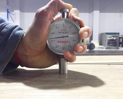 Hardness test on surface of wpc flooring